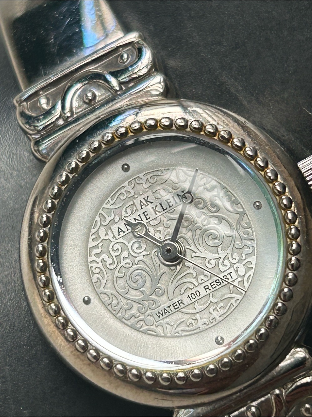 Anne Klein silvertone ladies watch with GORGEOUS pearlescent filigree dial.